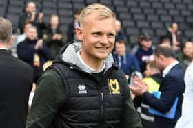 MK Dons head coach Liam Manning said he is fully focused on the play-off campaign against Wycombe Wanderers. He has however been linked with the manager’s job at Queens Park Rangers this week.