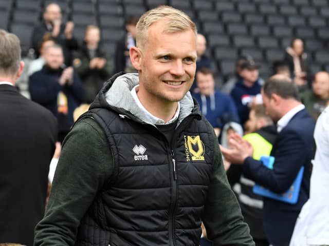 MK Dons head coach Liam Manning said he is fully focused on the play-off campaign against Wycombe Wanderers. He has however been linked with the manager’s job at Queens Park Rangers this week.