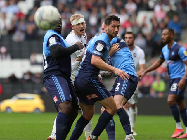 <p>Harry Darling felt the impact of Wycombe Wanderers when the sides met at Stadium MK earlier this season after taking a hit to the head. Dons take on the Chairboys in the play-offs and Darling has said both games will be like cup finals</p>
