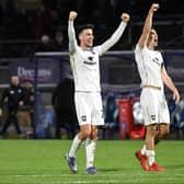 Daniel Harvie and Warren O’Hora celebrate the win over Wycombe at Adams Park earlier this season. Harvie says preparation for the play-offs has been like any other for MK Dons this week.