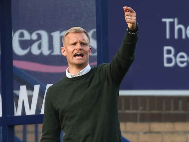 <p>Liam Manning said MK Dons got dragged into a game which suited Wycombe Wanderers in the first leg of the play-offs</p>