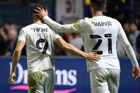 Scott Twine and Daniel Harvie after the 2-0 defeat to Wycombe Wanderers on Thursday. Head coach Liam Manning said his side are not out of the tie yet but will need to dig deep at Stadium MK on Sunday