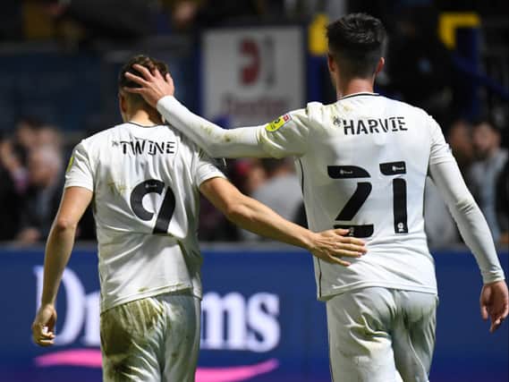 Scott Twine and Daniel Harvie after the 2-0 defeat to Wycombe Wanderers on Thursday. Head coach Liam Manning said his side are not out of the tie yet but will need to dig deep at Stadium MK on Sunday