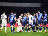Tempers flared when the sides met on Thursday at Adams Park. Both Liam Manning and Dean Lewington believe more pressure will be on Wycombe when the sides meet at Stadium MK
