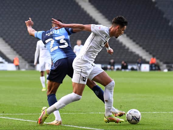 Theo Corbeanu in action in his final game for MK Dons before returning to parent club Wolves