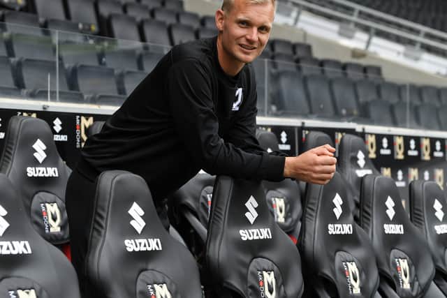 The new kid on the block - Liam Manning looks over his new dugout at Stadium MK