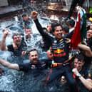 Sergio Perez celebrates his Monaco Grand Prix win with his Red Bull Racing team. The Mexican held talks with his bosses after he was asked to move over in Spain to allow Max Verstappen to win.