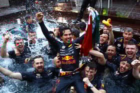 Sergio Perez celebrates his Monaco Grand Prix win with his Red Bull Racing team. The Mexican held talks with his bosses after he was asked to move over in Spain to allow Max Verstappen to win.