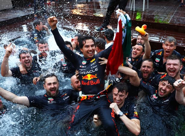<p>Sergio Perez celebrates his Monaco Grand Prix win with his Red Bull Racing team. The Mexican held talks with his bosses after he was asked to move over in Spain to allow Max Verstappen to win.</p>