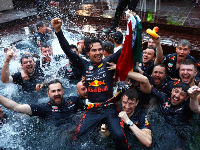 <p>Sergio Perez celebrates his Monaco Grand Prix win with his Red Bull Racing team. The Mexican held talks with his bosses after he was asked to move over in Spain to allow Max Verstappen to win.</p>