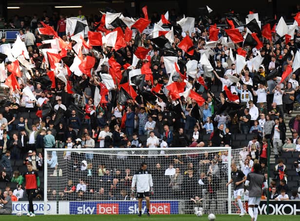 <p>MK Dons supporters during the second leg of the play-off semi-final at Stadium MK</p>