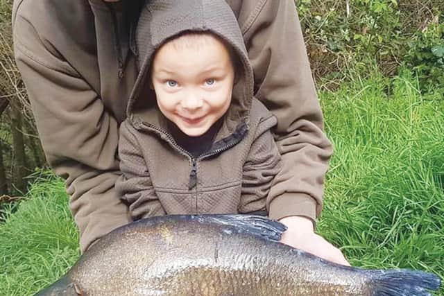 Young Harlen gets to grips with a 10lb Tiddenfoot bream