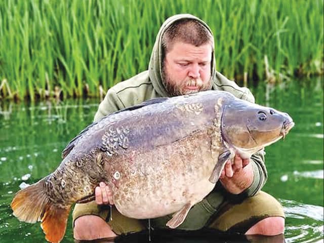 <p>WHAT a fish! Rays Preedy returning his 48lb PB</p>