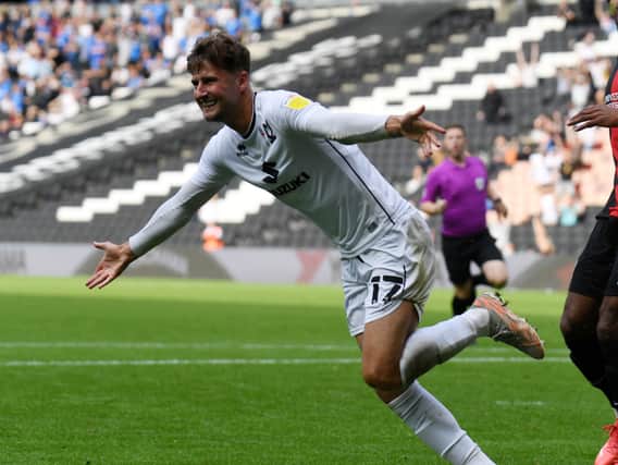 Ethan Robson has completed his move back to MK Dons. The former Blackpool midfielder spent the first half of last season on loan at Stadium MK from Blackpool