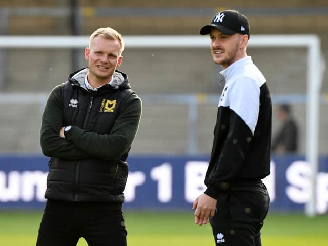<p>Liam Manning and Josh McEachran in discussion ahead of the play-off semi-final first-leg against Wycombe Wanderers last season.</p>