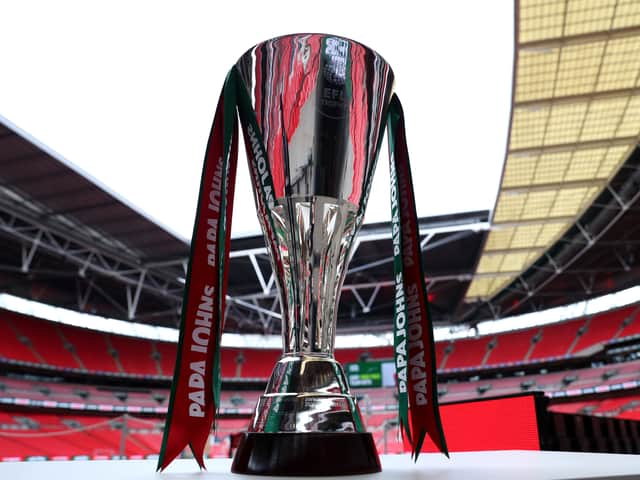 <p>The Papa John’s Trophy. MK Dons lifted the trophy in 2008 under the name Johnstone’s Paint Trophy.</p>