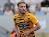 Rumours linked Cambridge United striker Sam Smith to MK Dons earlier this week, but assistant head coach Chris Hogg said even he was surprised by them. 