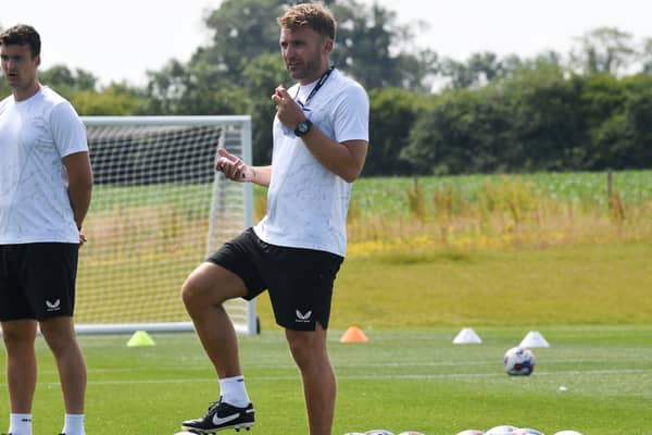 MK Dons assistant head coach Chris Hogg said he was pleased to see the side come through their first pre-season game with AFC Rushden & Diamonds unscathed, and with a 4-0 win in their pockets