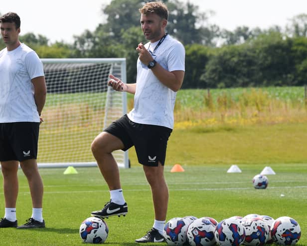 MK Dons assistant head coach Chris Hogg said he was pleased to see the side come through their first pre-season game with AFC Rushden & Diamonds unscathed, and with a 4-0 win in their pockets