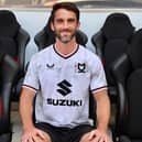 Will Grigg is finally an MK Dons player after signing a deal to join the club after being released by Sunderland