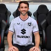 Will Grigg is finally an MK Dons player after signing a deal to join the club after being released by Sunderland