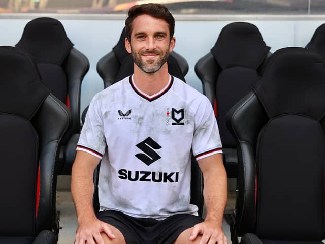 Will Grigg is finally an MK Dons player after signing a deal to join the club after being released by Sunderland