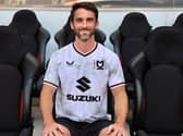 Will Grigg is finally an MK Dons player after signing a deal to join the club after being released by Sunderland