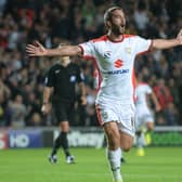 Will Grigg celebrates scoring the first of two goals in the 4-0 win over Manchester United in August 2014