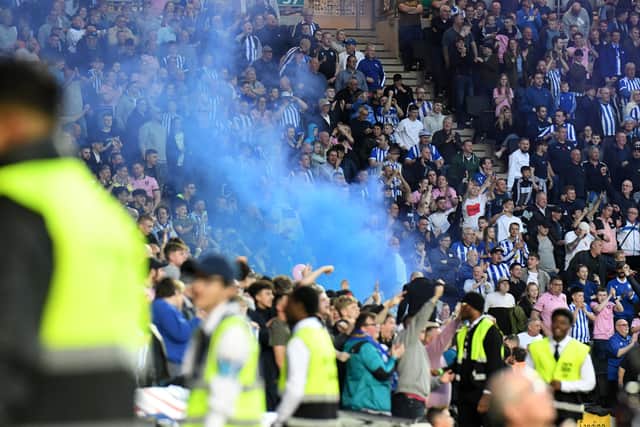 A smoke bomb was let off during the game between Sheffield Wednesday and MK Dons at Stadium MK last season. Anyone caught letting off pyrotechnics will be banned by their club.