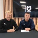 Ronnie Sandford signs his first professional contract with Liam Manning and Lewis Price