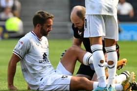 Will Grigg limped out with what appeared to be a hamstring issue in the first half