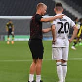 Dons head coach Liam Manning said he was impressed with his young side on Tuesday night as they knocked Sutton United out of the Carabao Cup. Darragh Burns was one of the players making his full debut for the club on the night at Stadium MK