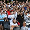 MK Dons supporters cheer their side on against Sheffield Wednesday. The club say they have more season ticket holders  despite price hikes than last year 