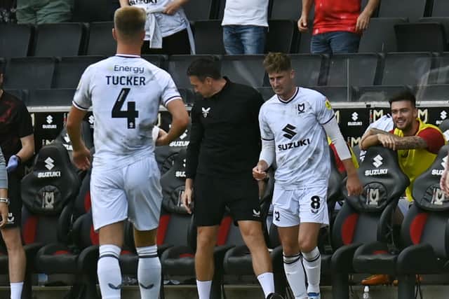 Ethan Robson celebrated his strike against Accrington by racing over to hug Price on the bench