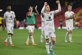 Dan Kemp leads the celebrations after MK Dons’ win over Watford in the Carabao Cup on Tuesday night