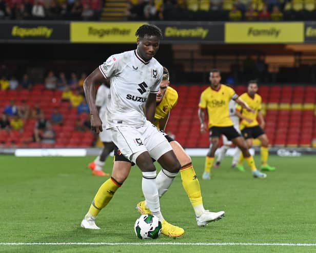 Daniel Oyegoke in action against Watford in MK Dons’ Carabao Cup win on Tuesday night