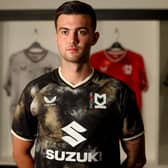 Daniel Harvie models the new MK Dons third strip, but so far it has split opinion amongst the supporters