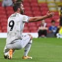 Will Grigg says he is keen to put his Sunderand experience behind him after finding the net for MK Dons against Morecambe on Saturday 