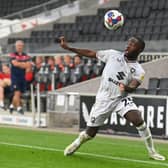 Brooklyn Ilunga is an emerging talent at MK Dons, and Daniel Harvie has said he is on-hand to help the teenager as they play in a similar position