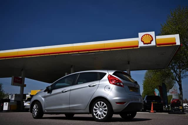 While prices have fallen around the country, the RAC says retailers could pass on further savings (Photo by BEN STANSALL/AFP via Getty Images)