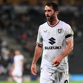 Will Grigg has called on the fans to continue to back them at Oxford on Saturday after MK Dons were booed from the Stadium MK pitch following the 2-0 defeat to Bolton Wanderers