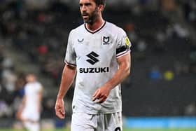 Will Grigg has called on the fans to continue to back them at Oxford on Saturday after MK Dons were booed from the Stadium MK pitch following the 2-0 defeat to Bolton Wanderers