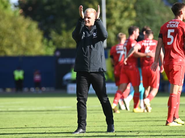 Liam Manning admitted he was a nervous man after John Mousinho’s late header pulled one back for Oxford, but MK Dons held on to claim their first ever league win at the Kassam Stadium