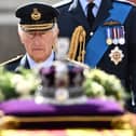 King Charles III walks behind the coffin of Queen Elizabeth II. Photo: Getty