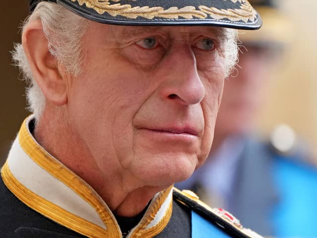 King Charles III follows the coffin of Queen Elizabeth II as it travels inside Windsor Castle on September 19. 