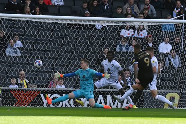 Johnson Clarke-Harris was left with a simple finish to give Peterborough a second minute lead at Stadium MK on Saturday