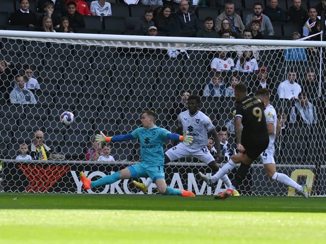 Johnson Clarke-Harris was left with a simple finish to give Peterborough a second minute lead at Stadium MK on Saturday