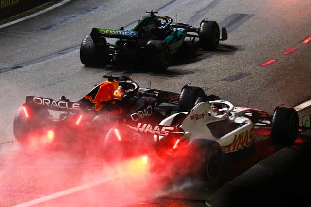 Max Verstappen battled side-by-side with Haas’ Kevin Magnussen in the opening laps