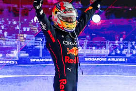 Sergio Perez celebrates atop his Red Bull Racing car after winning a gruelling Singapore Grand Prix on Sunday. Team-mate Max Verstappen was made to wait to win his second world championship