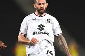 Bradley Johnson was full of praise for Dons boss Liam Manning, but said the players need to live up to their potential before it is too late